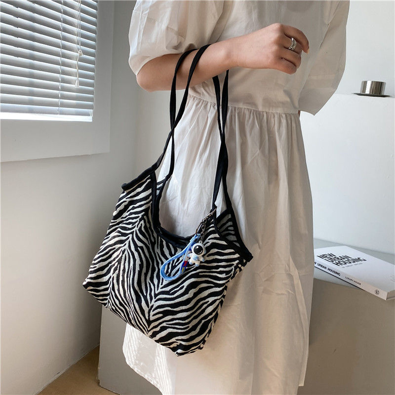 Korean Style Zebra Pattern Large Capacity Idle Style Ins Hand Carrying Shoulder Bag Shopping Bag Simple Artistic Canvas Schoolbag for Women