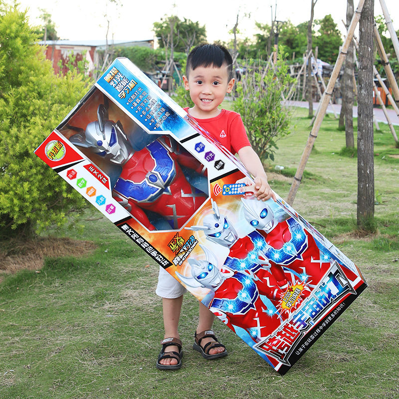 boy and children‘s toy oversized diga terothello shapeshifting robot transformation set across ultraman superman