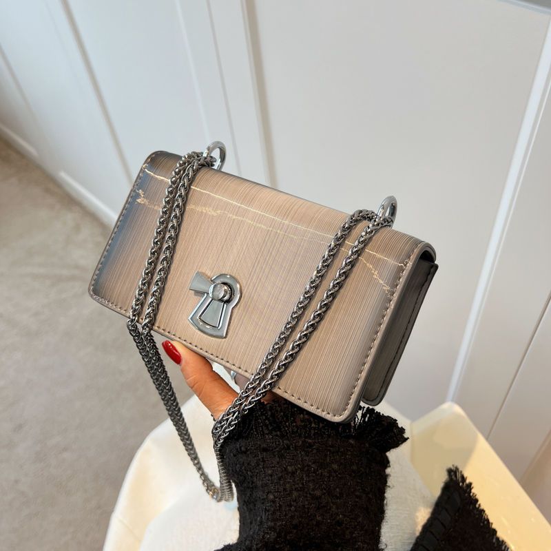 patent leather glossy women‘s bag summer 2024 new high-grade texture chain underarm bag niche fashion messenger bag