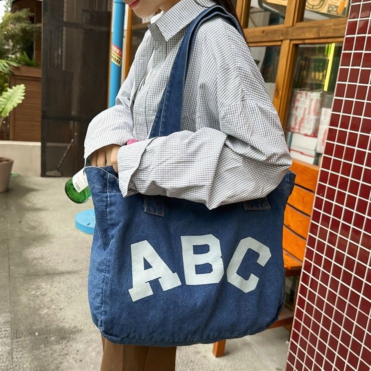 大容量慵懶風印花字母簡約通勤單肩帆布包大學生上課裝書牛仔布包