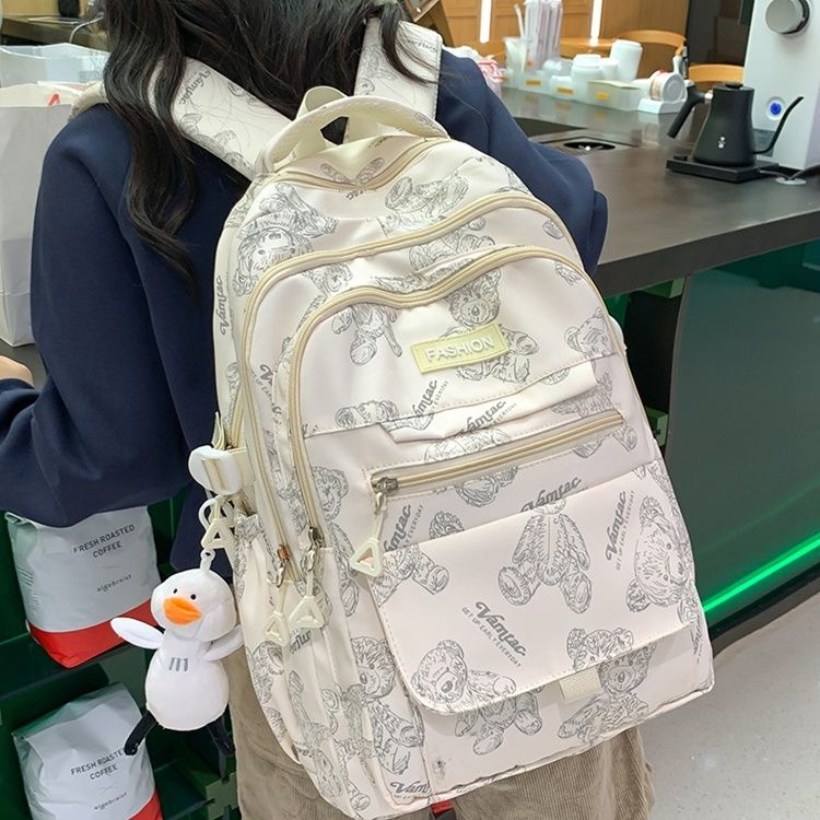 School bag for female junior high school students simple and versatile printed bear niche design 2023 new college student computer backpack trend