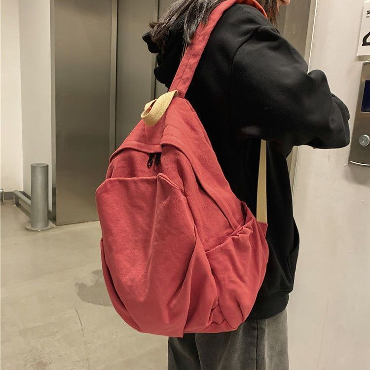 日系水洗帆布雙肩包簡約百搭大學生書包女慵懶風初高中垂感背包女