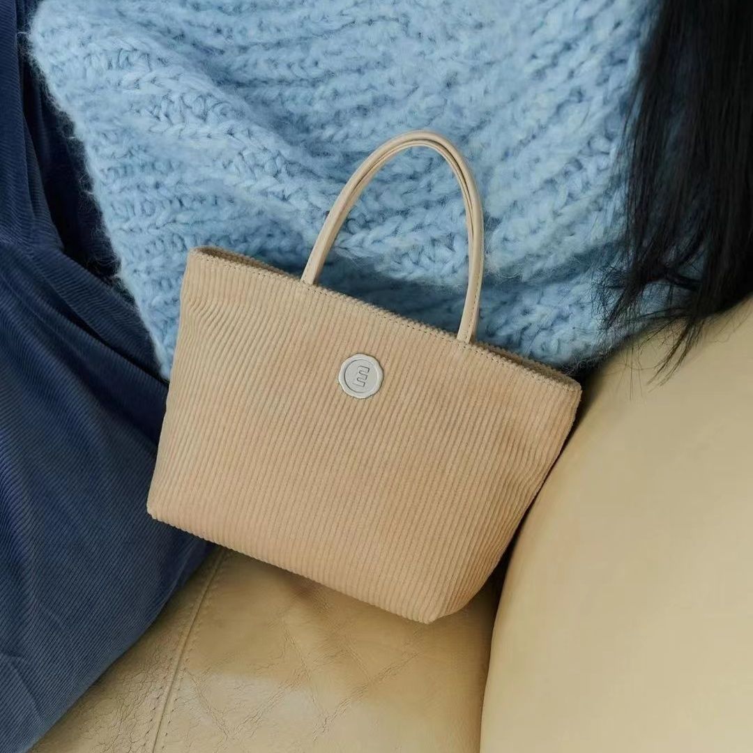 Autumn and winter new corduroy handbag Korean purchasing niche mini portable basket bag commuting versatile tote bag