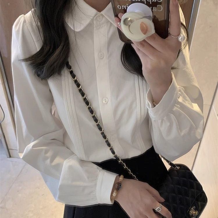 Doll collar white shirt for women in autumn and winter new style layered with accordion pleat shirt and long-sleeved top with unique design