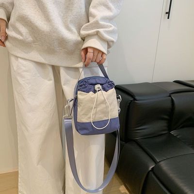 日系拼色抽绳小包休闲百搭骑行单肩斜挎包男女户外手机水壶水杯包优惠商品图片