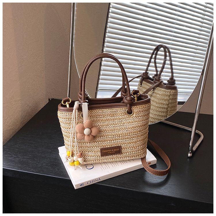 Borsa a secchiello in paglia intrecciata donna, borsa a righe_voghion.com