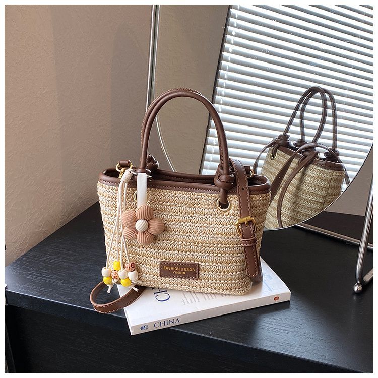 Borsa a secchiello in paglia intrecciata donna, borsa a righe_voghion.com