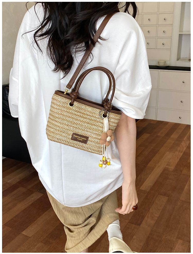 Borsa a secchiello in paglia intrecciata donna, borsa a righe_voghion.com