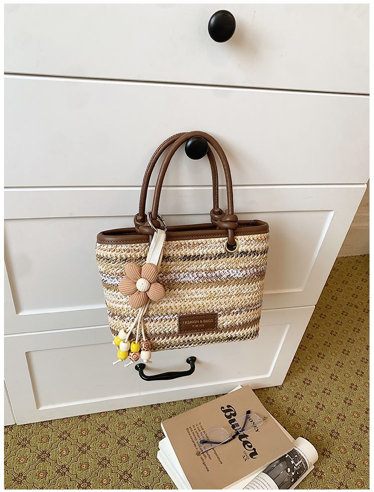 Borsa a secchiello in paglia intrecciata donna, borsa a righe_voghion.com