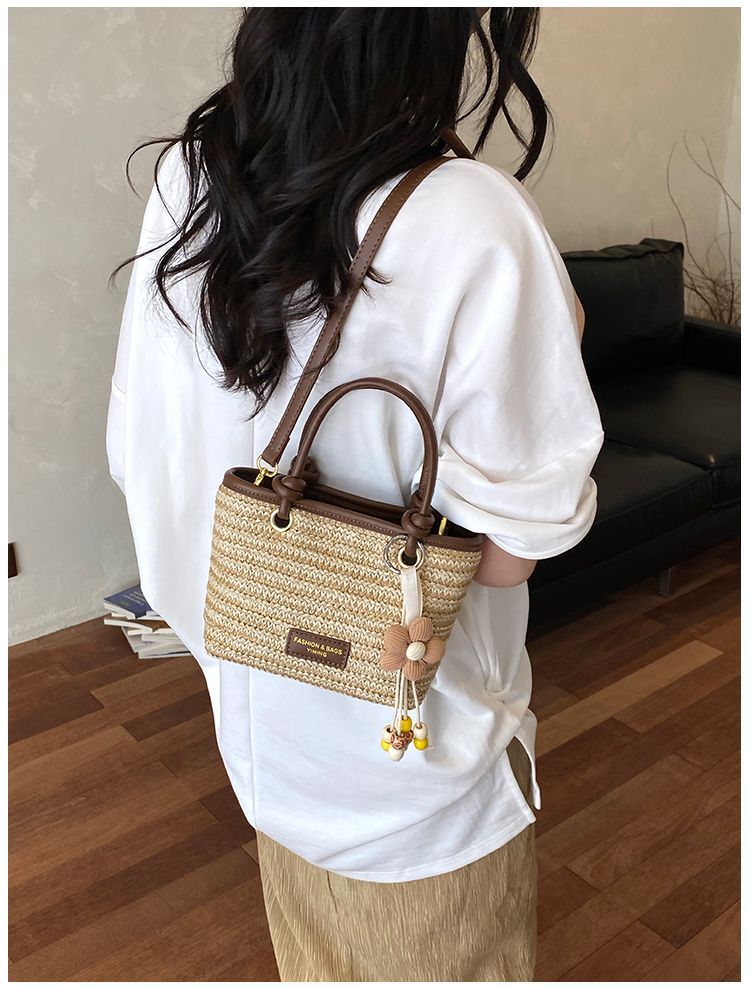 Borsa a secchiello in paglia intrecciata donna, borsa a righe_voghion.com
