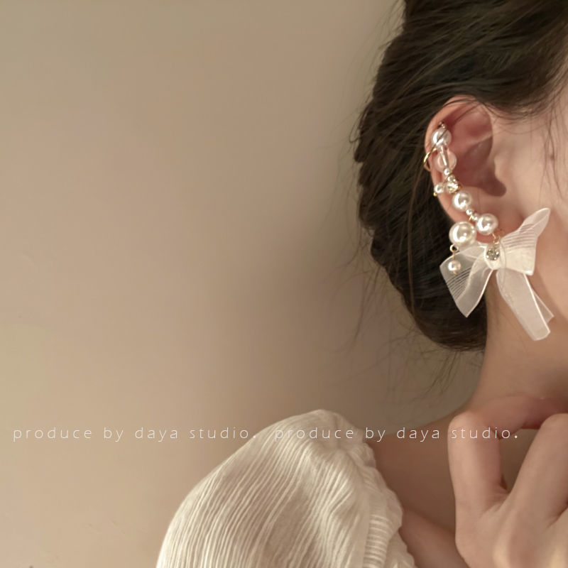 Wrapping around the ears Super Fairy Pearl Bow Knot Earrings with a high-level sense of luxury, light luxury, retro and gentle French-style niche earrings
