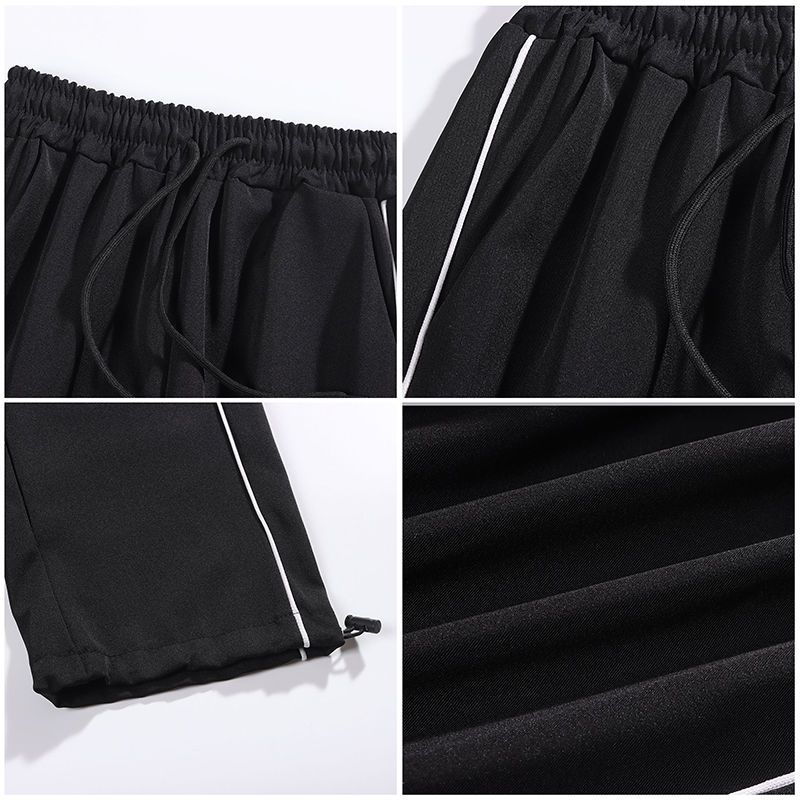 Ins pantaloni sportivi dritti e larghi per coppie, con un senso di caduta e vestibilità ampia. Pantaloni alla moda con coulisse allacciata alle gambe_voghion.com