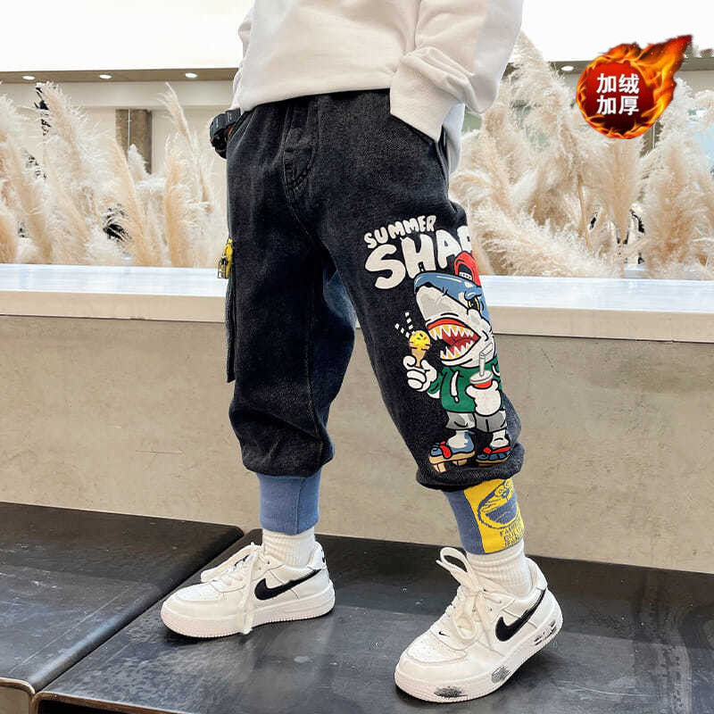 Children's clothing boy's trousers 2023 new cartoon print jeans medium and large children's Korean version handsome trousers with feet
