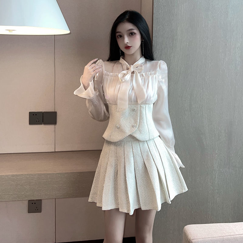 Hong Kong style retro fashion suit female 2023 spring and autumn new foreign style bow top pleated skirt two-piece set