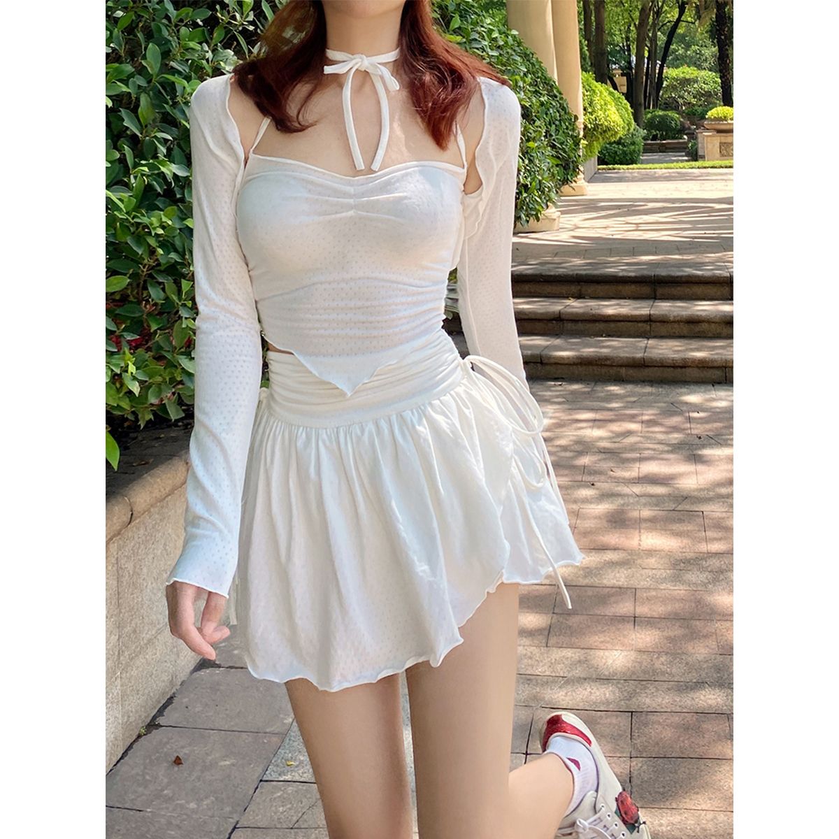 Pure lust-style white skirt for women, stylish drawstring pleated A-line short culottes, high-waisted anti-exposure irregular skirt