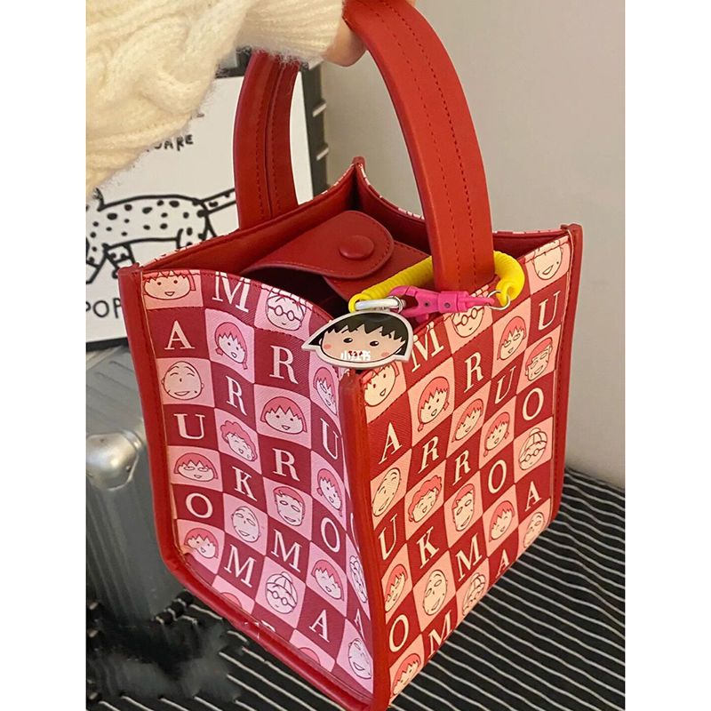 樱桃小丸子联名包包女新款可爱高级感卡通休闲手提包水桶包
