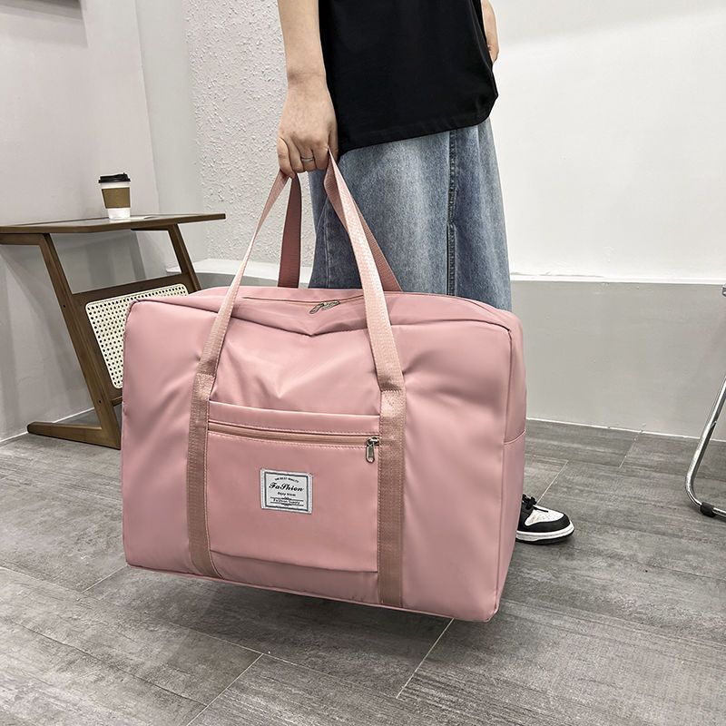 Large-capacity travel bag fashion waterproof duffle bag waiting bag storage bag finishing clothes packing bag female boarding bag
