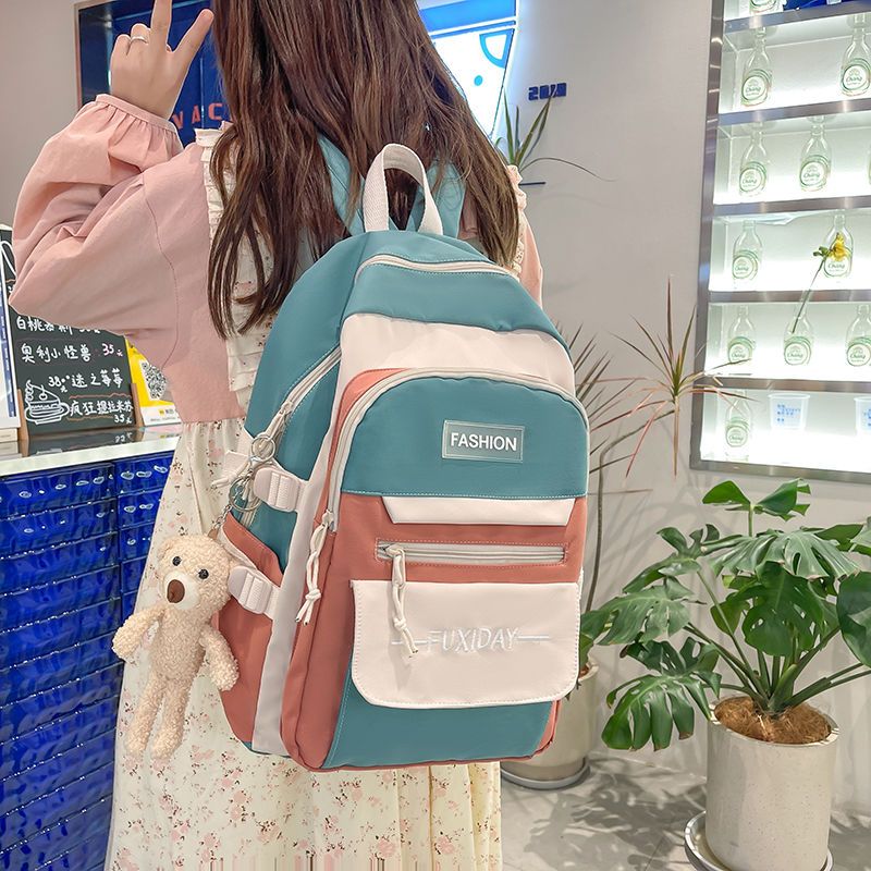 書包女中學生小學生四五六七八九年級初中生輕便護脊雙肩背包耐髒