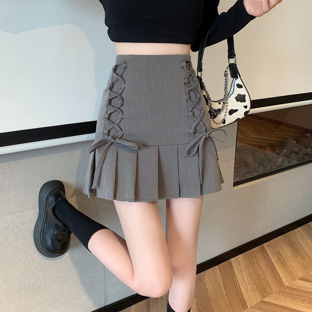 Slim a-line half-length strappy pleated skirt design hip-covering skirt summer 2023 new anti-exposure short skirt for women