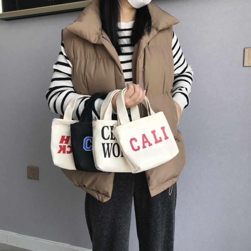 新款帆布化妆包女韩版手机包大容量水乳刷收纳袋便携百搭手提包