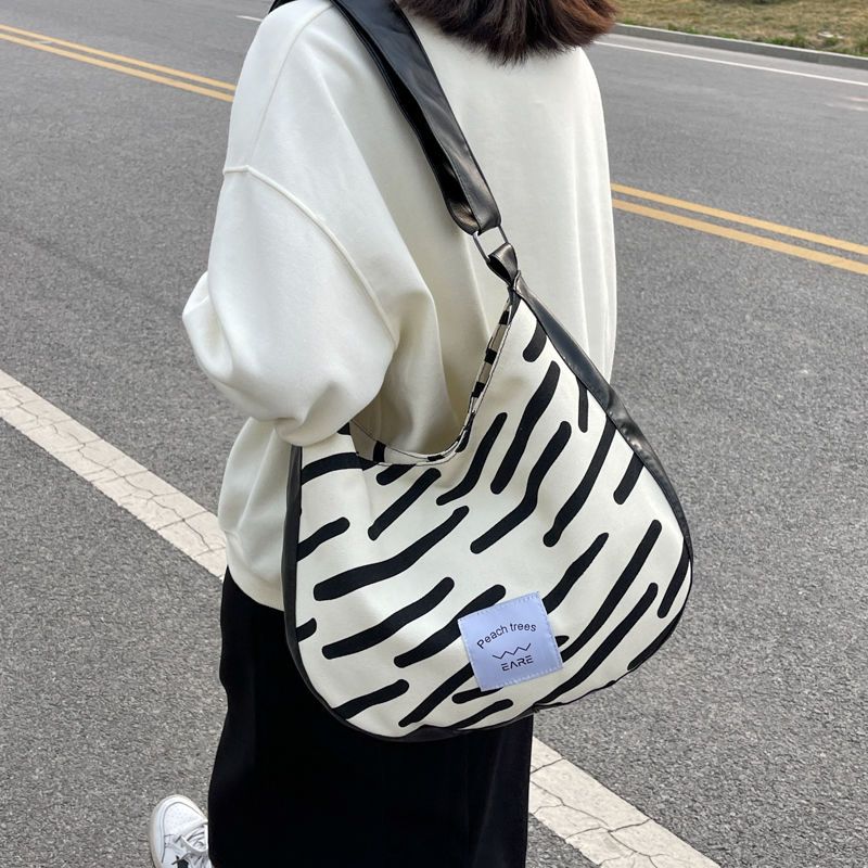 斑馬紋帆布包包女2022新款潮時尚布袋學生上課斜挎包撞色單肩大包