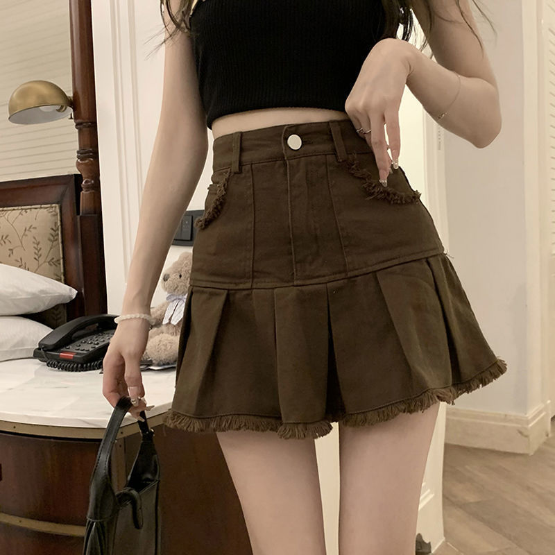 Spice girl brown denim skirt female ins summer 2023. New design sense niche raw edge pleated skirt