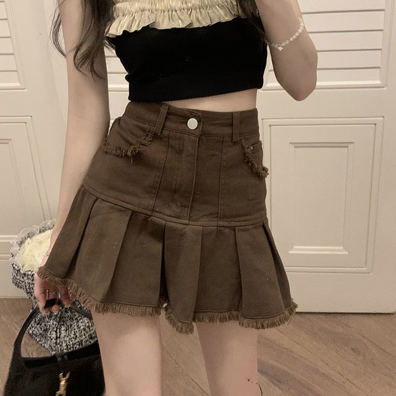 Spice girl brown denim skirt female ins summer 2023. New design sense niche raw edge pleated skirt