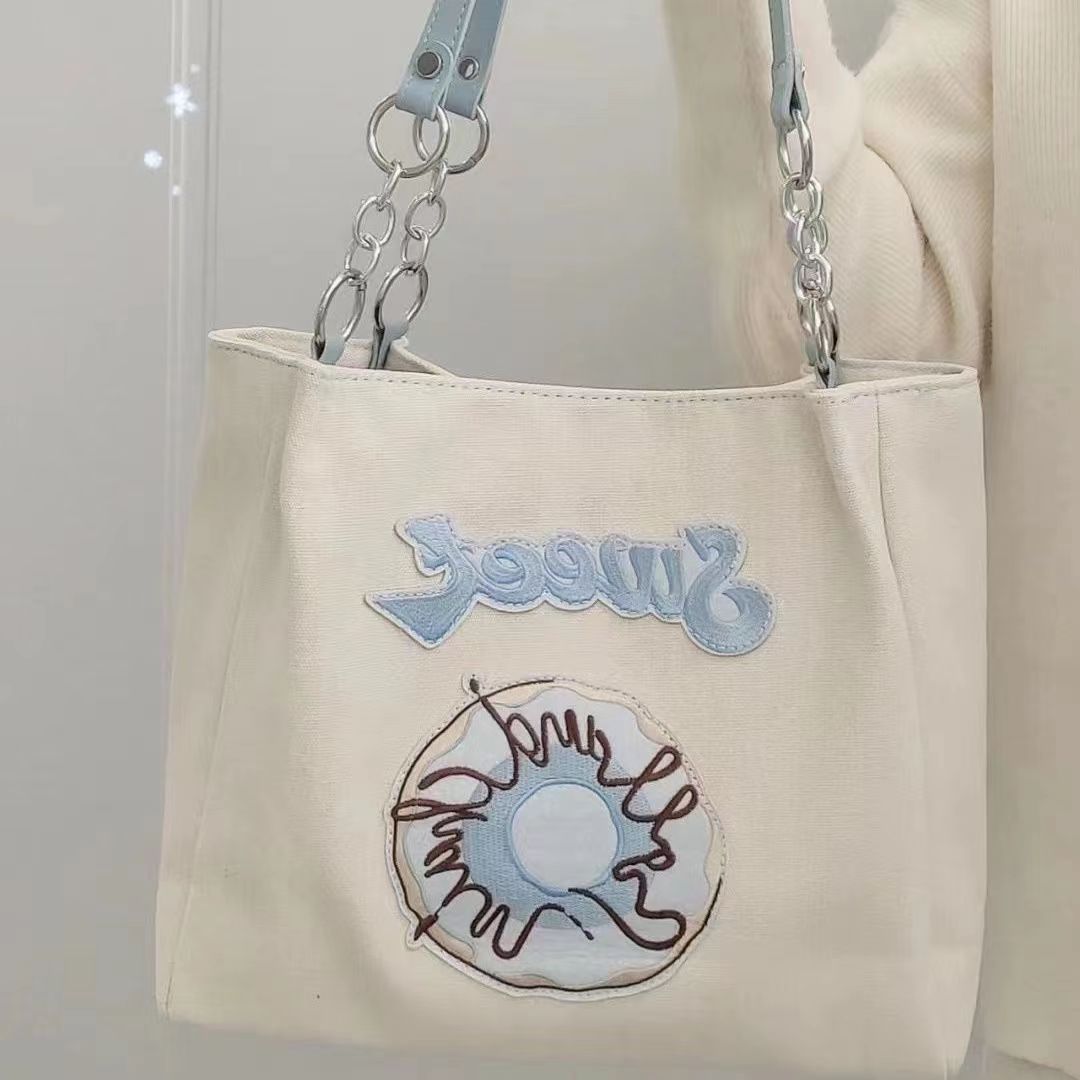 大容量小眾設計通勤帆布包2022新款流行時尚刺繡單肩手提包
