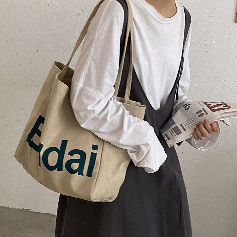 學生休閒大容量包女秋冬2022新款潮時尚印花帆布包韓版百搭單肩包