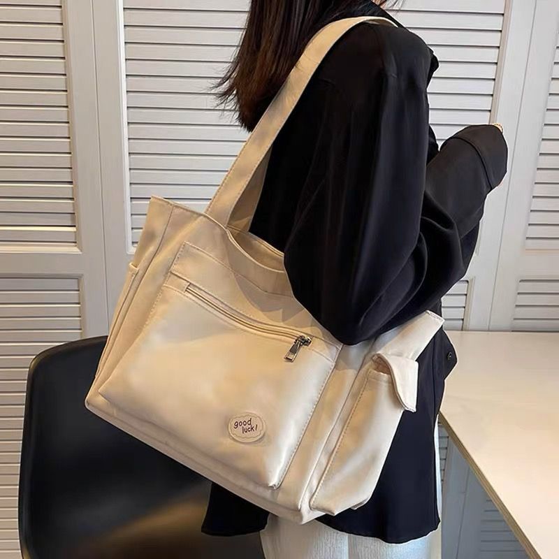 大學生上課通勤大容量手提布袋大包包女2022新款帆布包單肩托特包