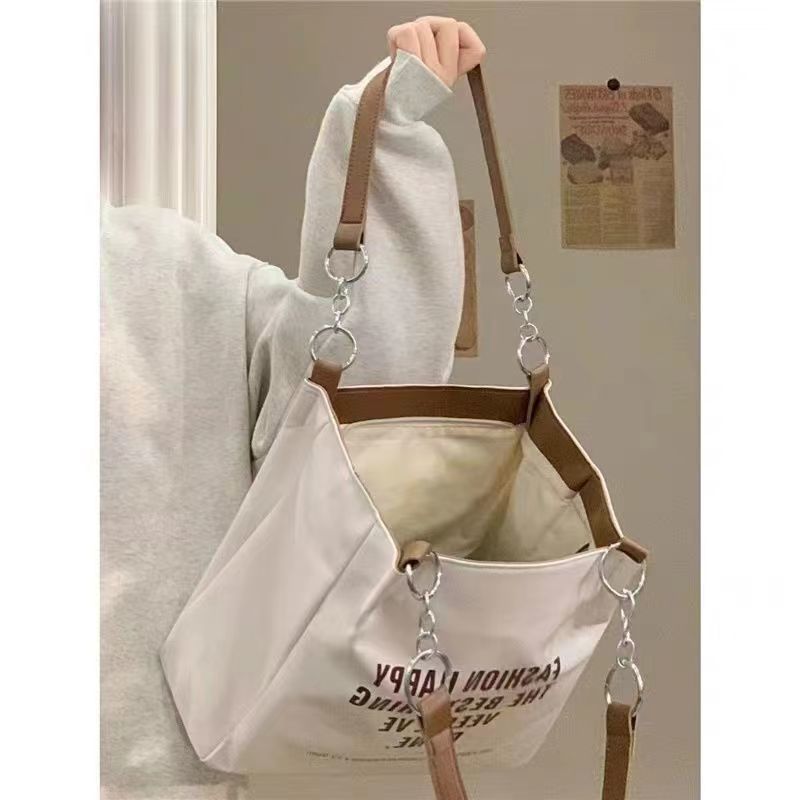 Summer 2023 niche design new bag women's large capacity hit color letter tote bag class commuting large bag