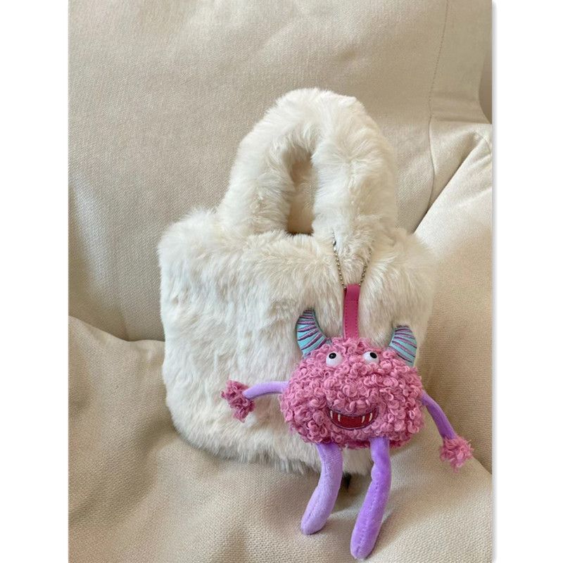 MCMK UR niche design cute little monster pendant bag female 2022 new plush bucket bag plush bag