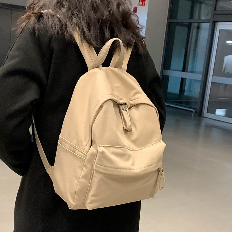 Huaxi schoolbag female college students high school students junior high school girls niche backpack black ladies simple girls backpack