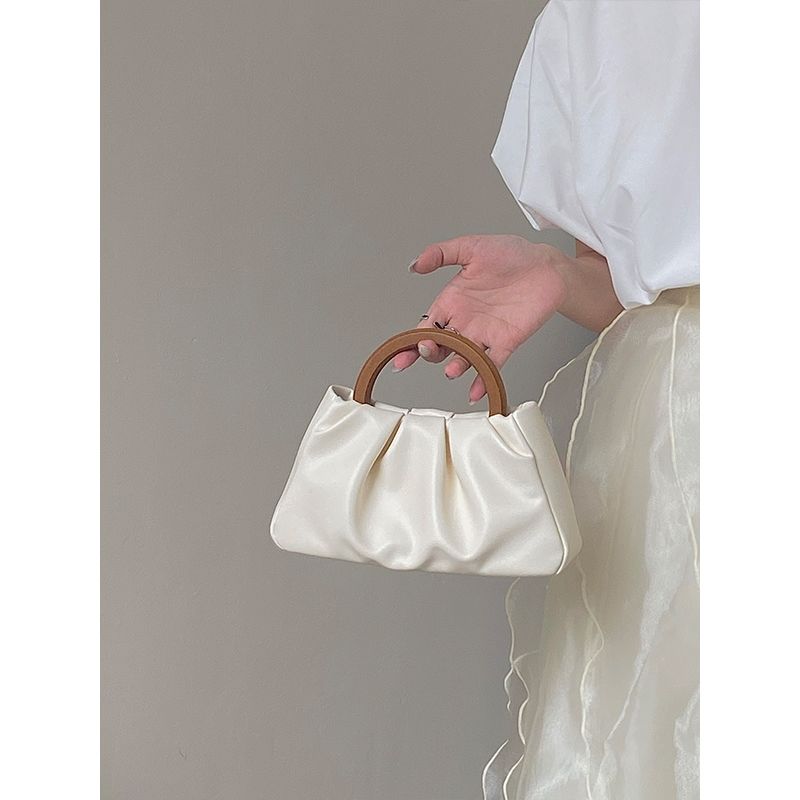 Retro wooden handle portable pleated cloud bag women's bag  new niche all-match ins Messenger small bag hand carry