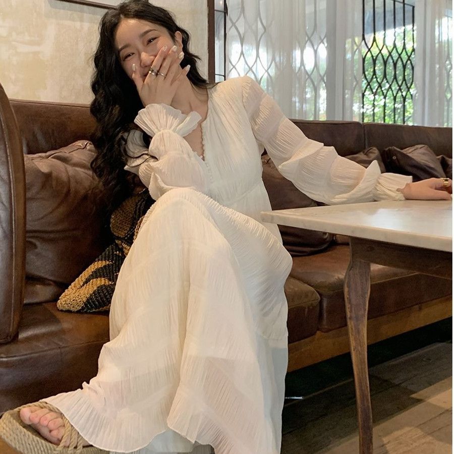 茶歇法式白色連衣裙女裝2023春季新款V領長袖設計感氣質高腰長裙