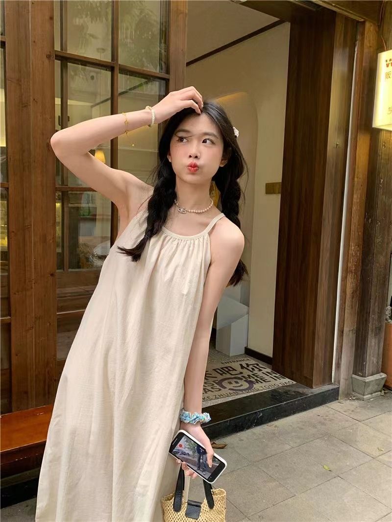 Lazy wind fringed suspender dress female spring 2023 new Korean style casual loose slim holiday long skirt
