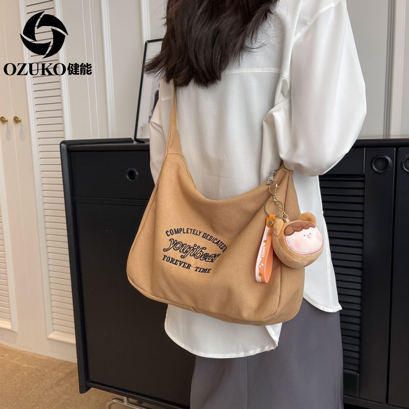 健能日系街頭字母大容量包包女2023新款休閒百搭上課通勤單肩斜挎