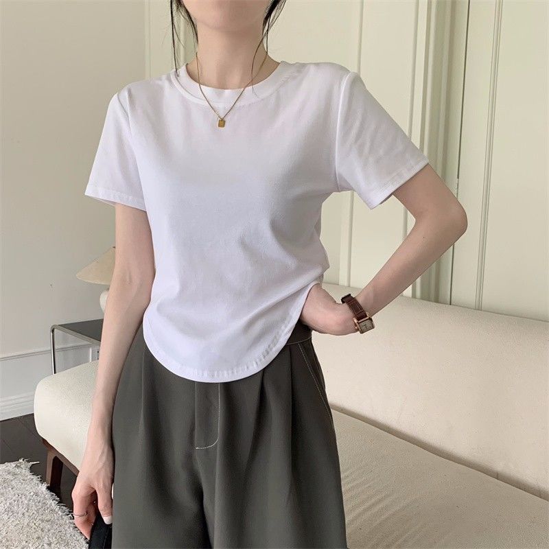 2023 summer new solid color all-match niche Korean version simple round neck hem irregular short-sleeved t-shirt female ins tide