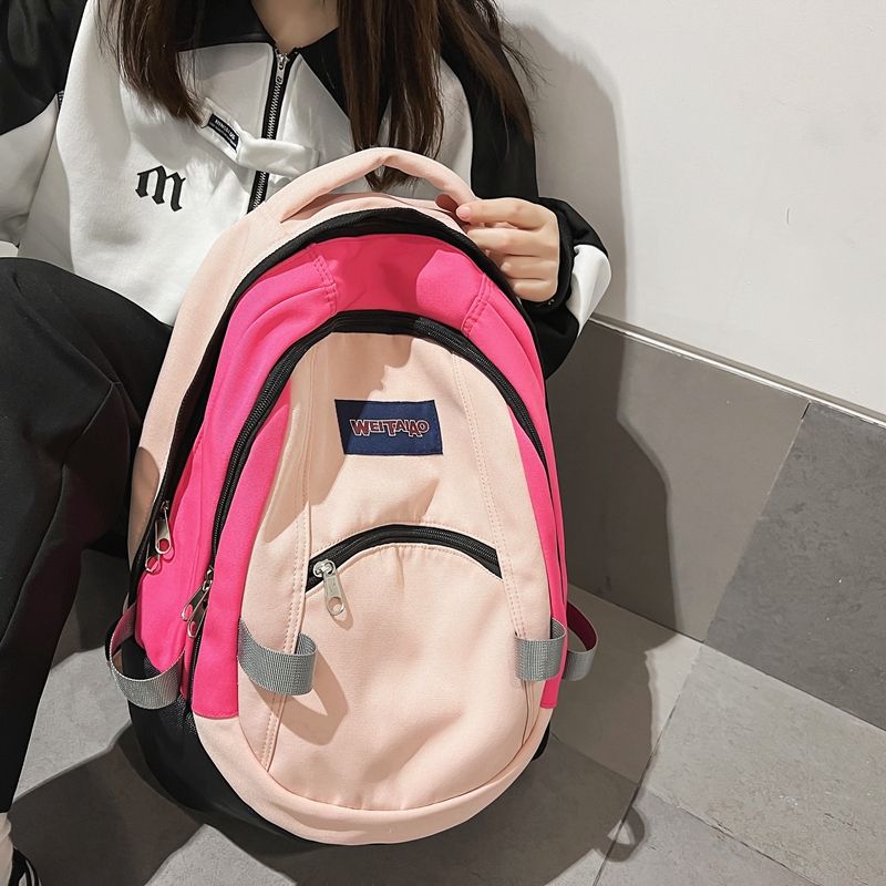 書包女大學生美式復古撞色雙肩包日系高中初中學生大容量運動背包