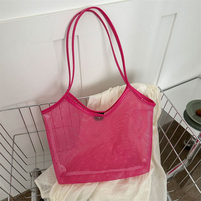 The new transparent mesh satchel bag female trendy ins style toy seaside beach bag large capacity mesh large bag fashion