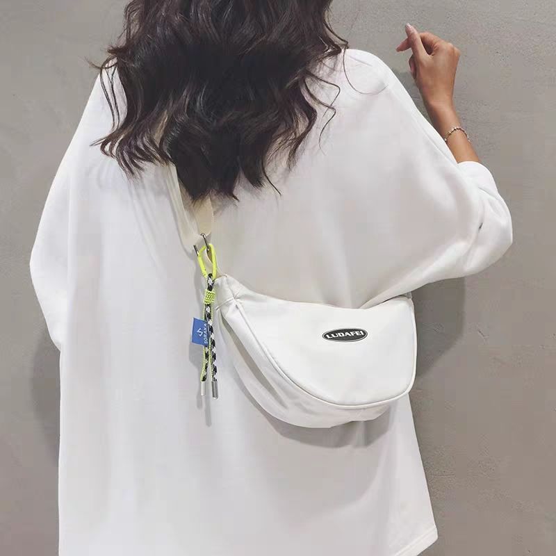 帆布包包女2023新款ins簡約通勤餃子單肩包休閒百搭尼龍斜挎小包