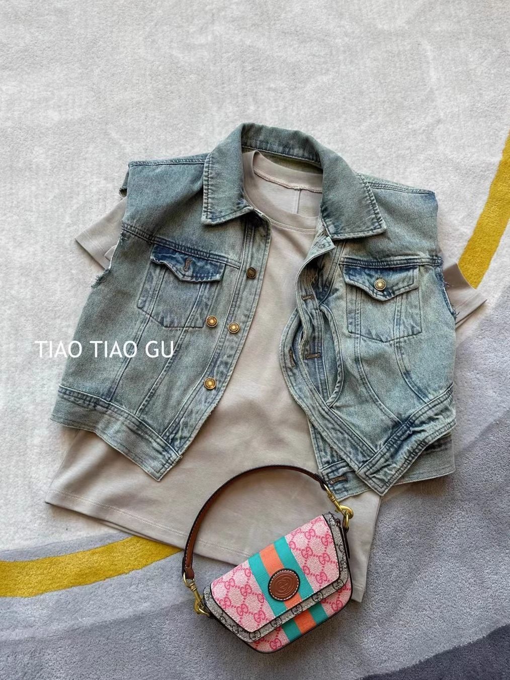 Hong Kong style trend spring and summer new shoulder pads Korean style fashion knot button design retro wash water denim vest tide