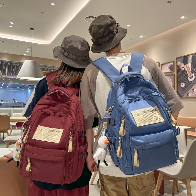 Schoolbag female junior high school student wear-resistant backpack male 2023 new large capacity primary school student high school student travel backpack trend