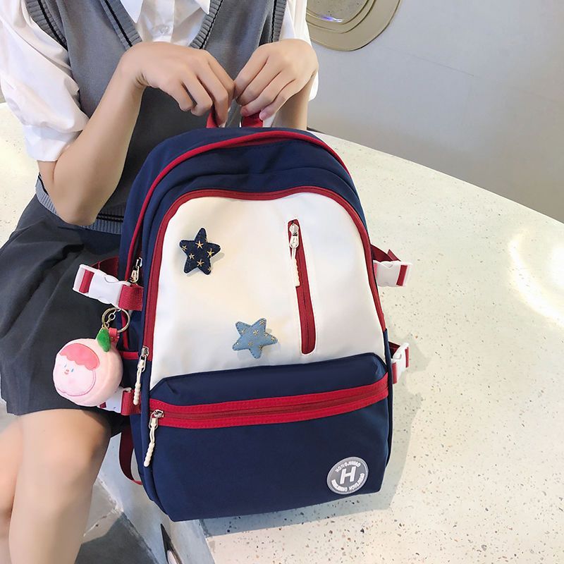 Schoolbags for junior high school girls with good looks, large capacity, contrasting colors and versatile 2023 new niche backpacks for college students, trendy and simple