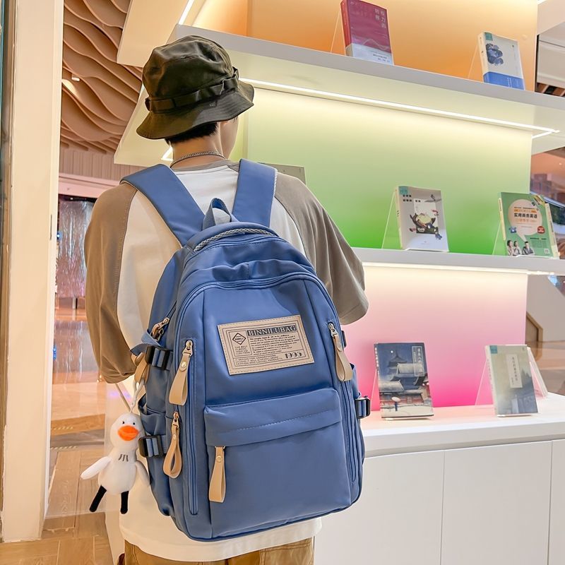 Schoolbag female junior high school student wear-resistant backpack male 2023 new large capacity primary school student high school student travel backpack trend