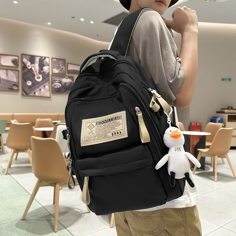 Schoolbag female junior high school student wear-resistant backpack male 2023 new large capacity primary school student high school student travel backpack trend