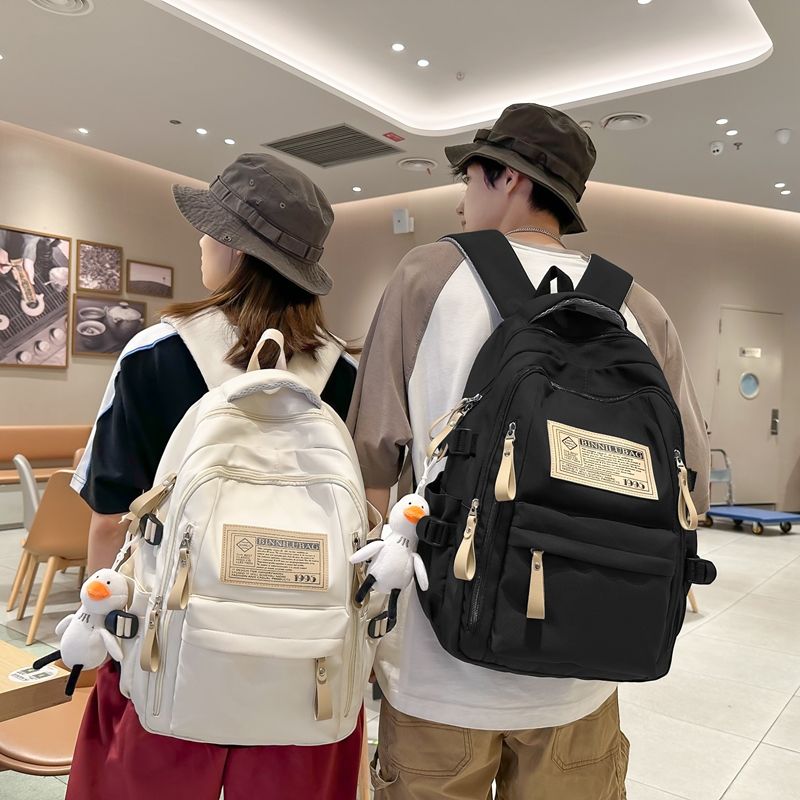 Schoolbag female junior high school student wear-resistant backpack male 2023 new large capacity primary school student high school student travel backpack trend