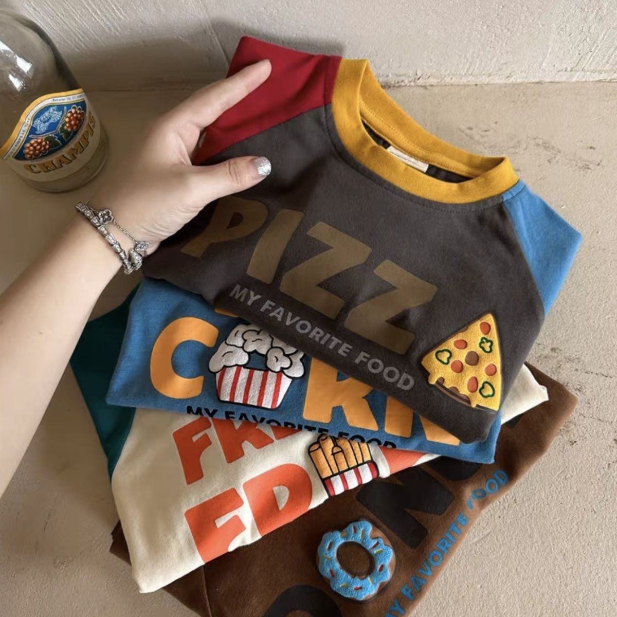 Children's long-sleeved T-shirt 2023 new autumn style for boys and girls Korean version of cartoon letters color-blocking raglan sleeve bottoming shirt round neck T