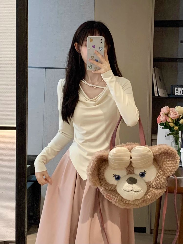 Long-sleeved t-shirt for women early autumn new solid color sweet and spicy cover belly slimming versatile irregular design niche tops trendy