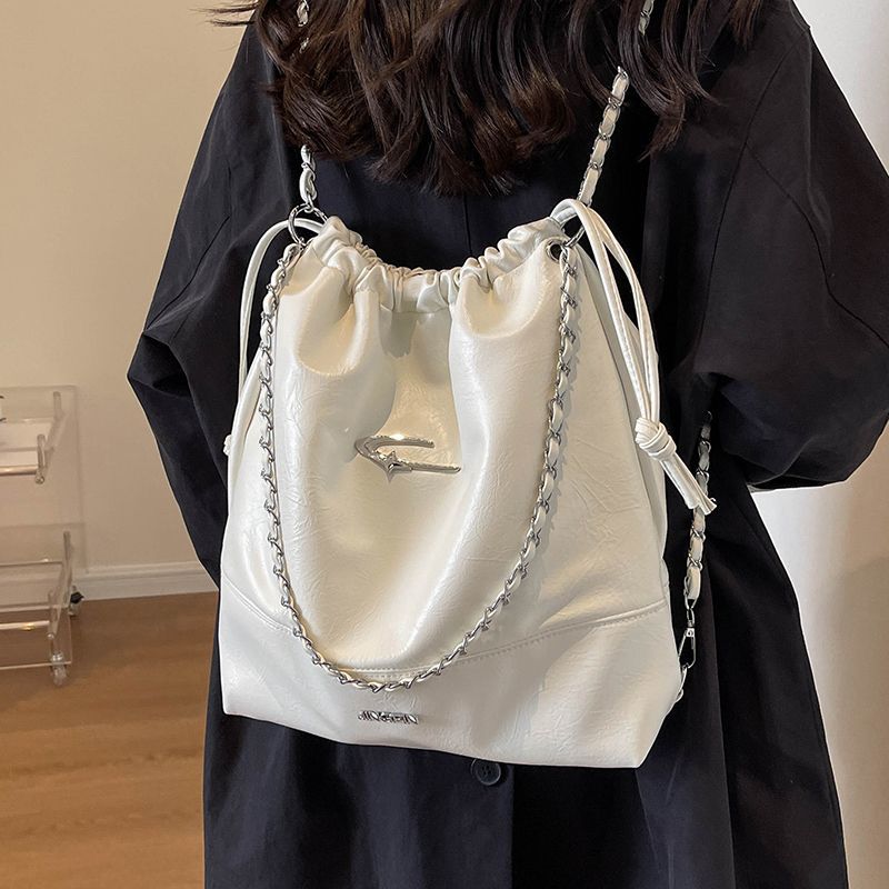 韩国小众夏季包包女新款链条抽绳小书包质感腊皮双肩包旅行包